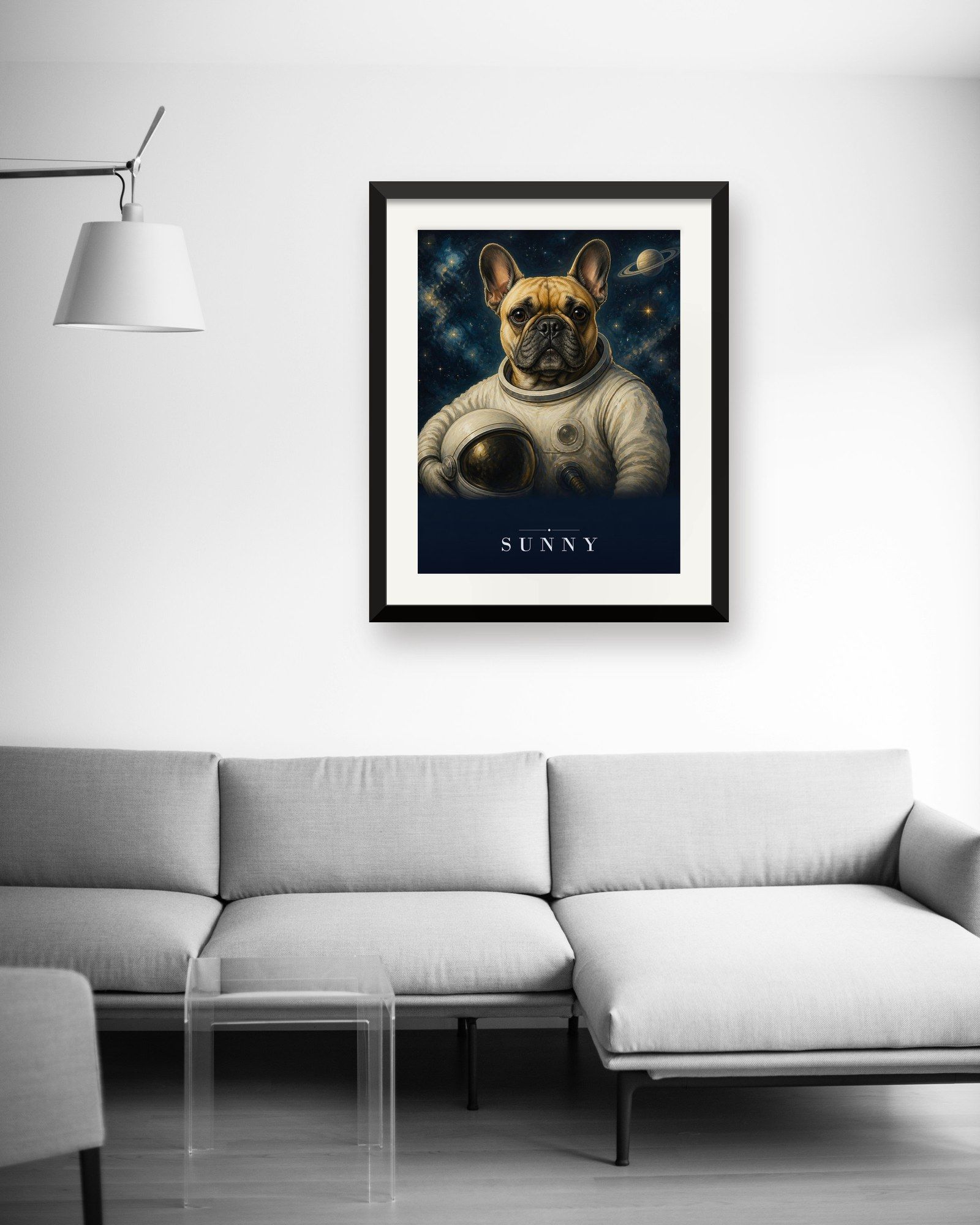 The printed portrait in a black frame above a light gray sofa (frame not included)